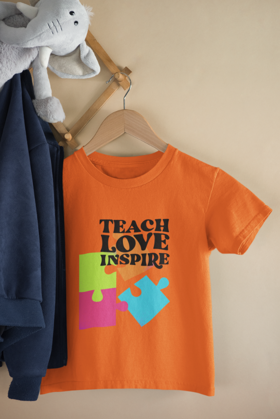 Kid's Teach Love Inspire Unisex T-shirt Light Pink by ZealforTee