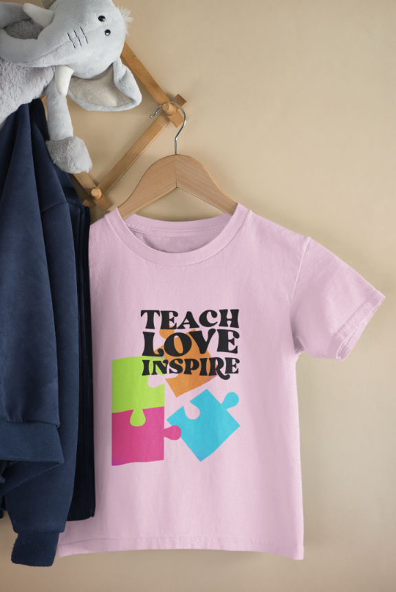 Kid's Teach Love Inspire Unisex T-shirt Light Pink by ZealforTee